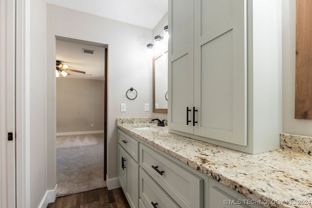 bathroom with vanity, wood-type flooring, and ceiling fan