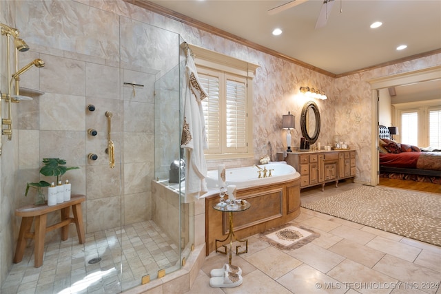 bathroom featuring vanity, ceiling fan, ornamental molding, and shower with separate bathtub