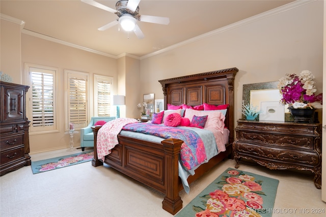 bedroom featuring crown molding, light colored carpet, and ceiling fan