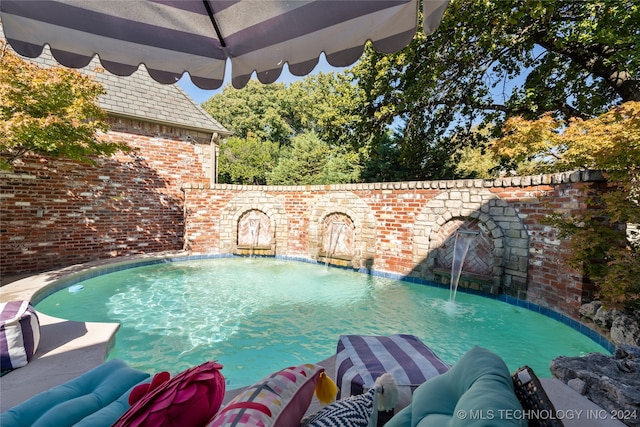 view of pool featuring pool water feature