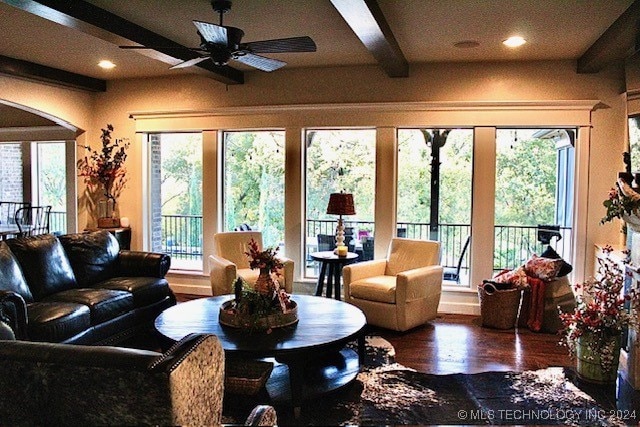 interior space with beamed ceiling and ceiling fan