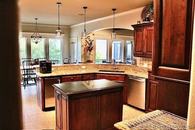 kitchen featuring a kitchen island, a sink, plenty of natural light, a peninsula, and dishwasher