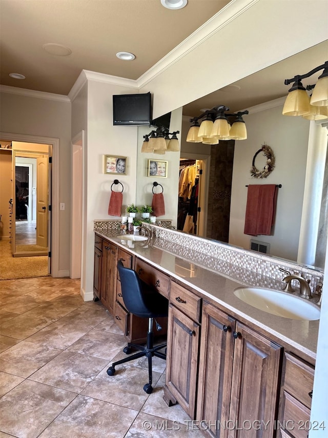 bathroom with double vanity, a sink, and crown molding