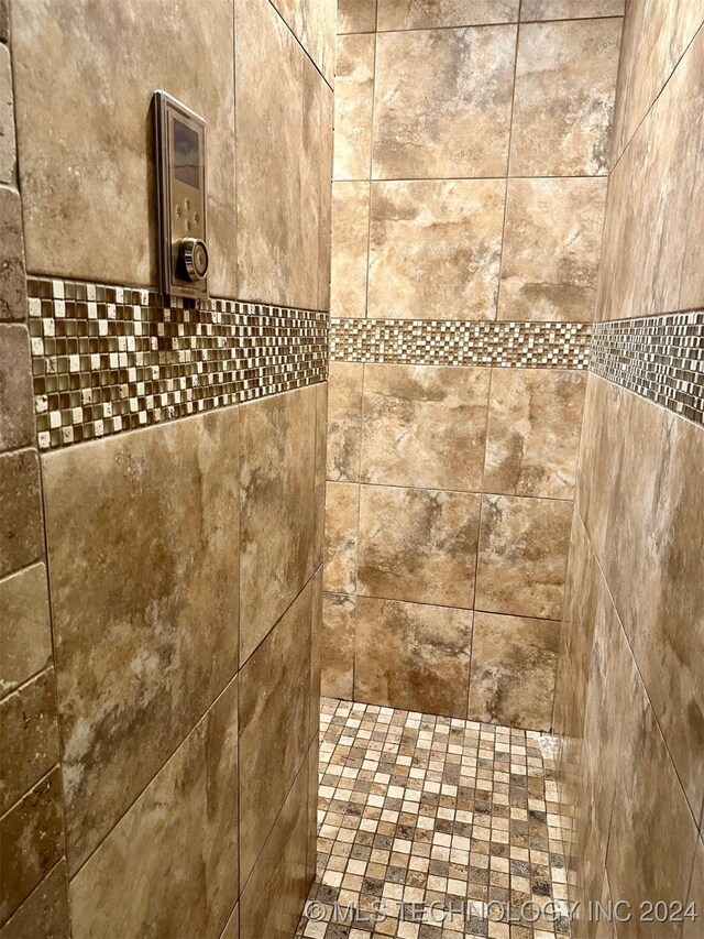 room details with a tile shower