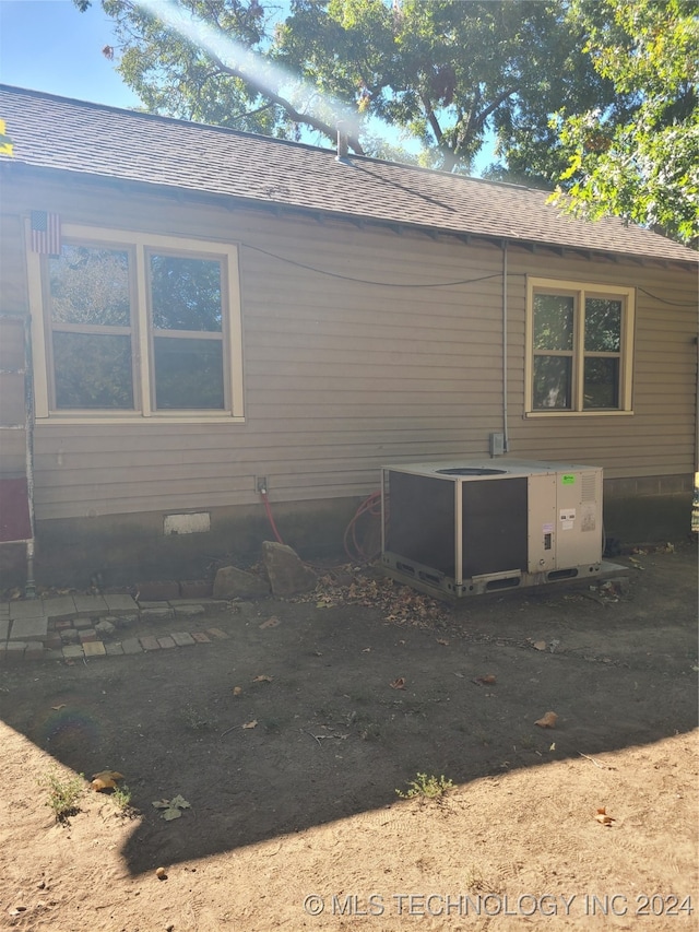 view of side of home with cooling unit