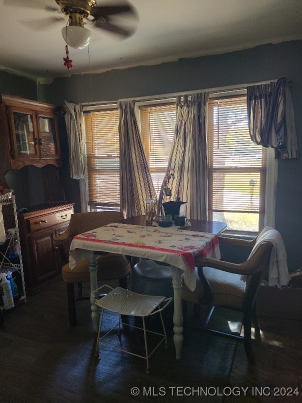 dining room featuring dark hardwood / wood-style floors and ceiling fan