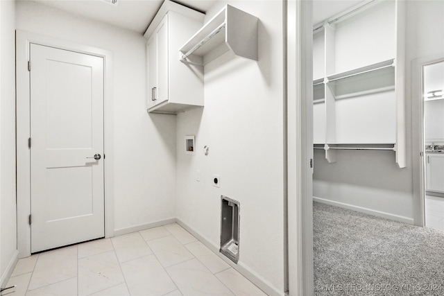 washroom featuring cabinets, hookup for an electric dryer, light carpet, and washer hookup