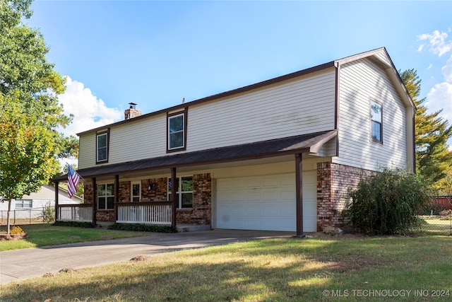 view of front of property featuring brick siding, a porch, concrete driveway, fence, and a front lawn