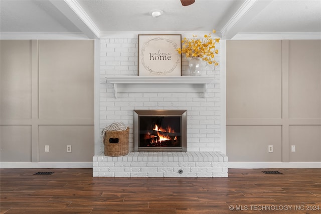 room details with a brick fireplace, a decorative wall, and crown molding