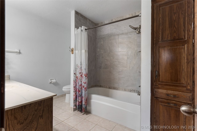 bathroom featuring shower / bath combo, vanity, toilet, and tile patterned floors