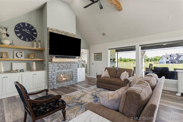 living room with ceiling fan, high vaulted ceiling, a fireplace, and dark hardwood / wood-style flooring