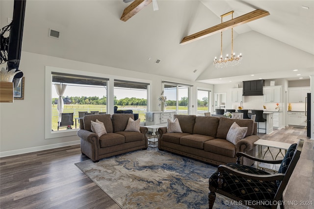 living room with an inviting chandelier, beam ceiling, dark hardwood / wood-style floors, and high vaulted ceiling