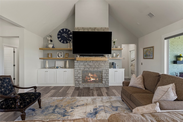 living room featuring a fireplace, wood-type flooring, and high vaulted ceiling