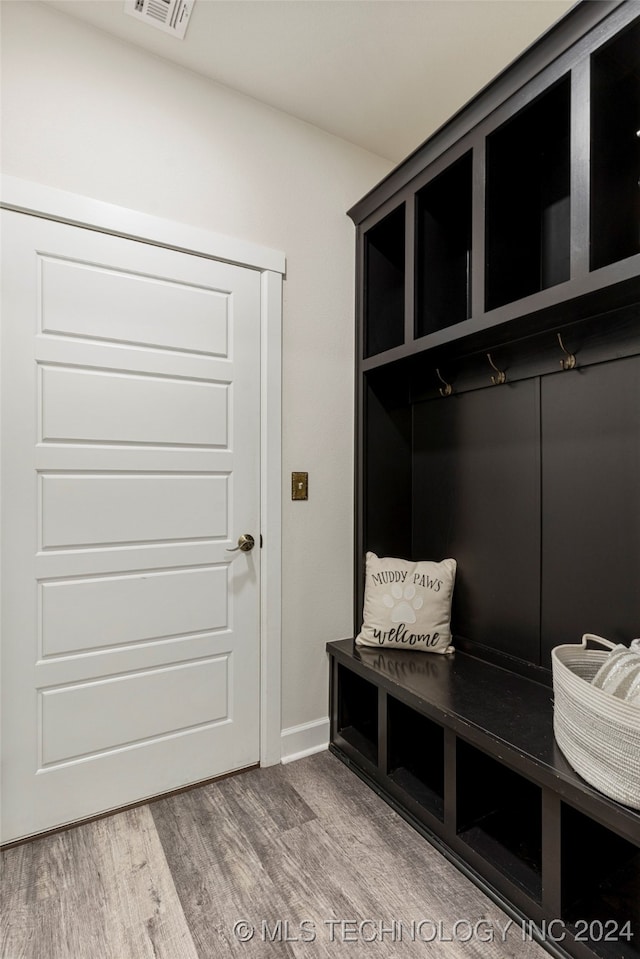 mudroom with hardwood / wood-style flooring