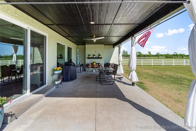 view of patio featuring ceiling fan