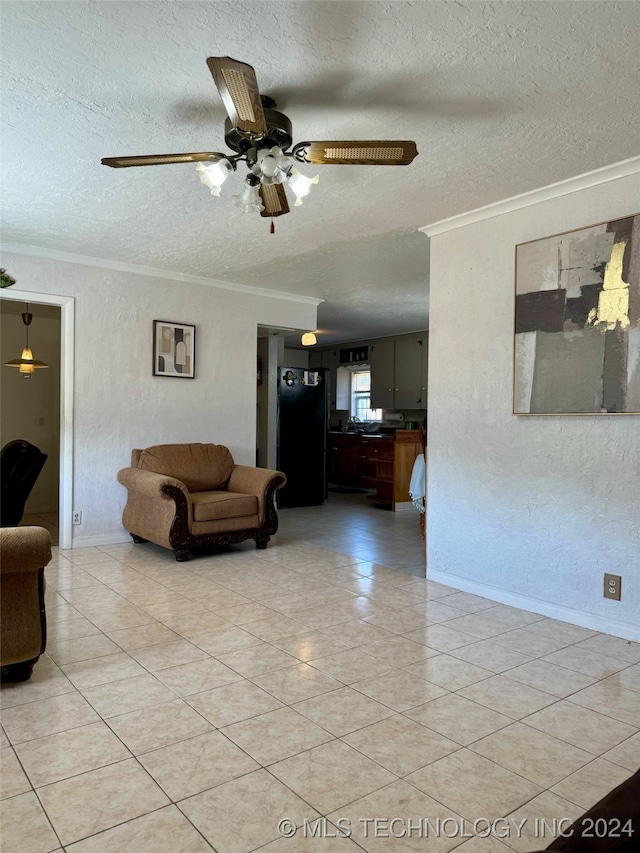 living room featuring ornamental molding, a textured ceiling, light tile patterned floors, and ceiling fan