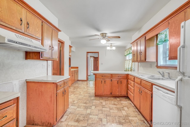 kitchen featuring kitchen peninsula, ceiling fan, sink, and white appliances