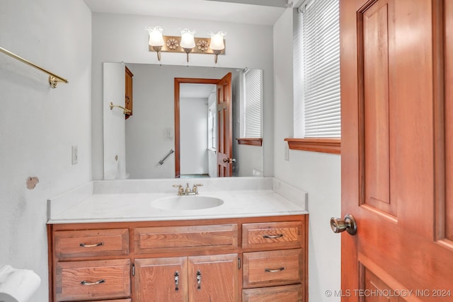 bathroom with vanity and a healthy amount of sunlight