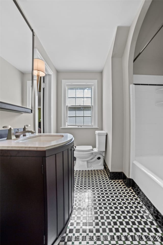 bathroom featuring toilet and vanity