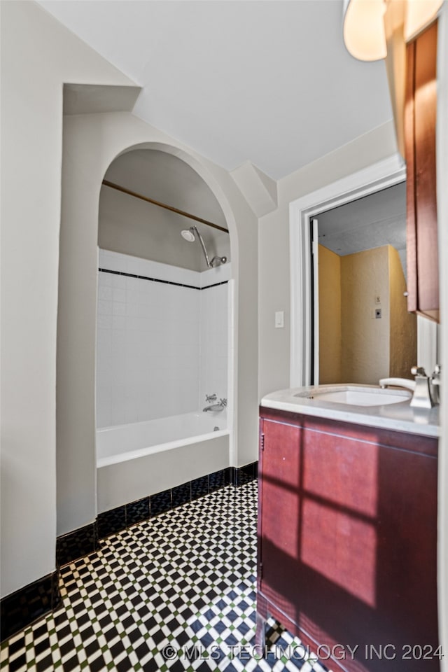 bathroom featuring vanity and shower / bathtub combination