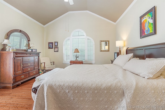 bedroom featuring ceiling fan, ornamental molding, lofted ceiling, and light hardwood / wood-style floors