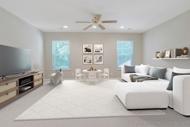 living room featuring ceiling fan and carpet floors