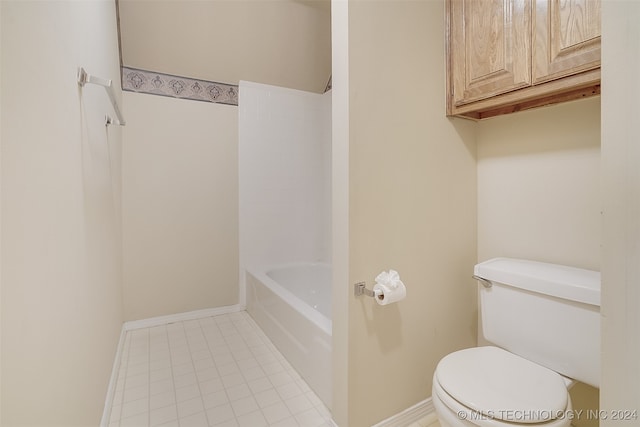 bathroom with shower / bathing tub combination and toilet