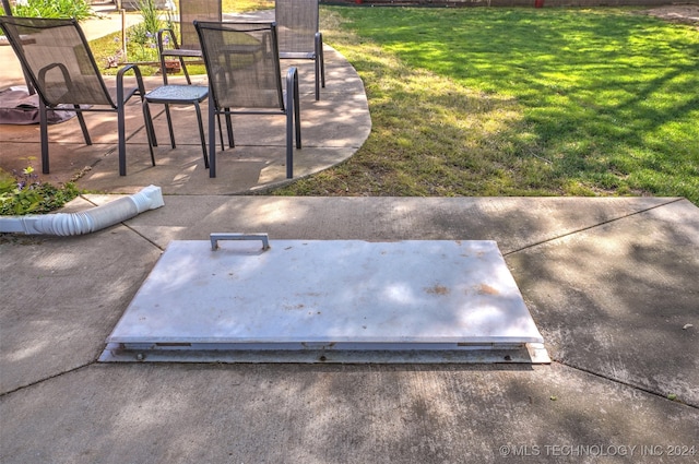 view of storm shelter with a lawn