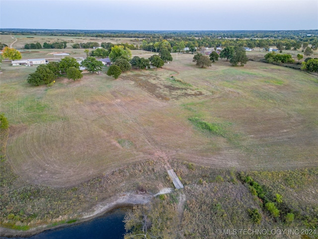 drone / aerial view with a water view and a rural view