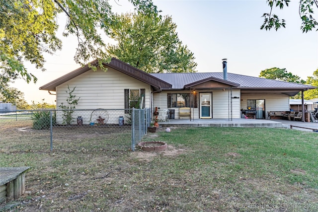 single story home featuring a patio and a front yard