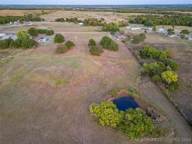 aerial view featuring a rural view and a water view