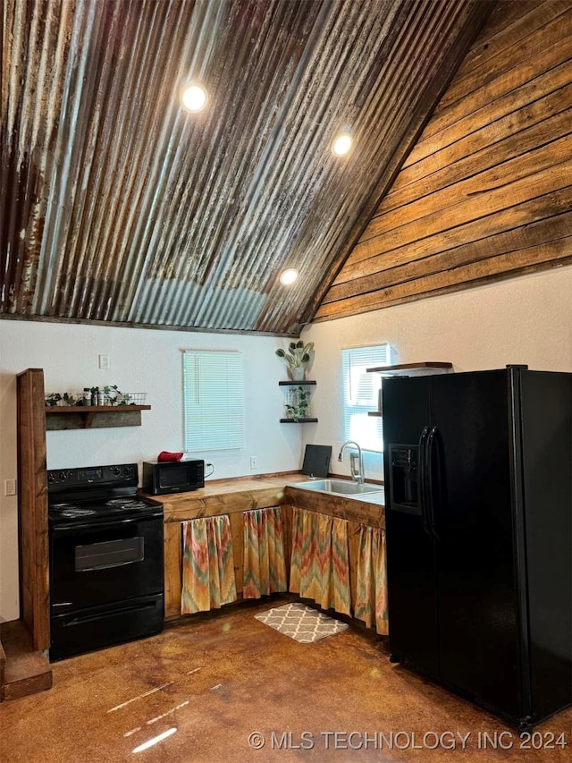 kitchen with carpet floors, black appliances, sink, and vaulted ceiling