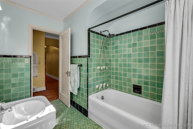 bathroom featuring tile walls, ornamental molding, shower / tub combo with curtain, and tile patterned floors