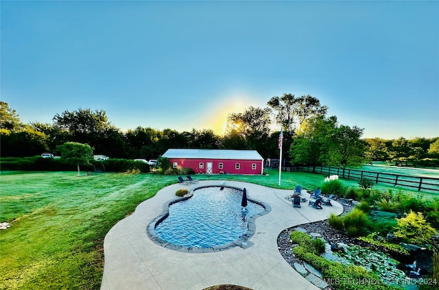 view of swimming pool with a yard and a patio