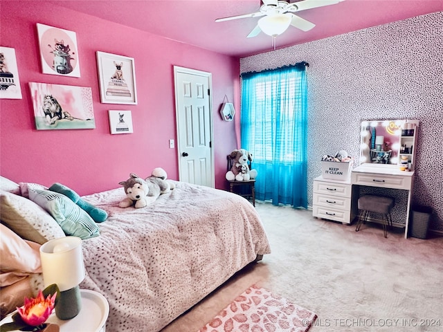 bedroom featuring ceiling fan and light carpet