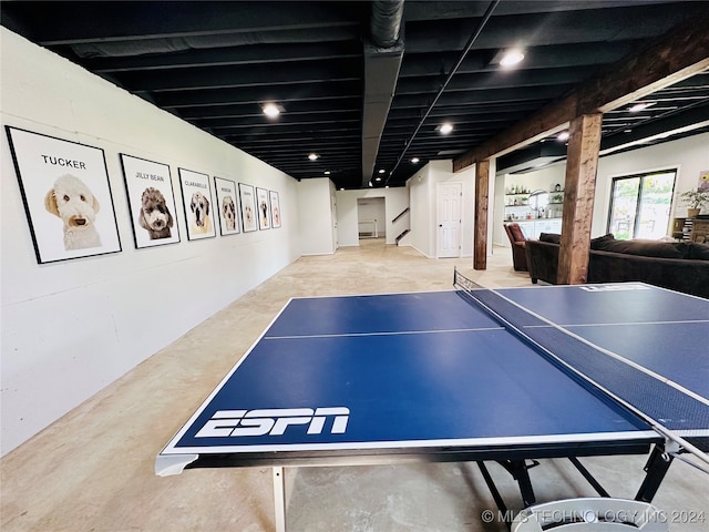 recreation room featuring concrete flooring