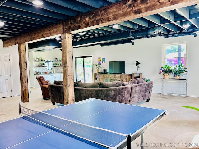 recreation room featuring concrete floors