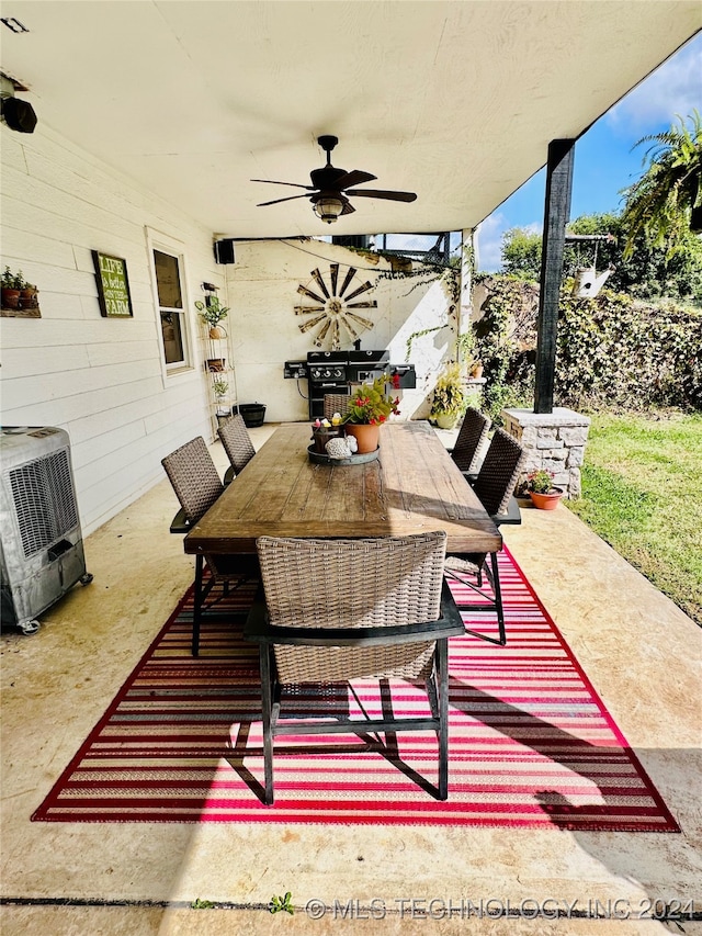 view of patio / terrace featuring area for grilling and ceiling fan