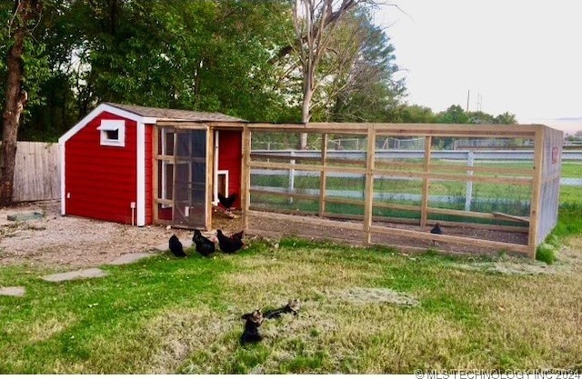 view of outbuilding with a lawn