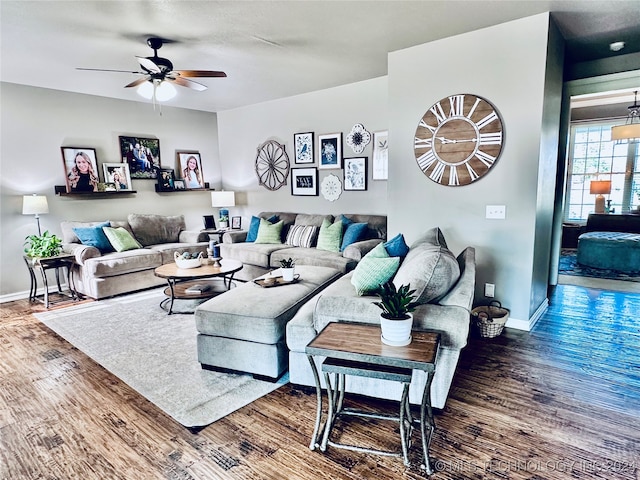 living room with hardwood / wood-style flooring and ceiling fan