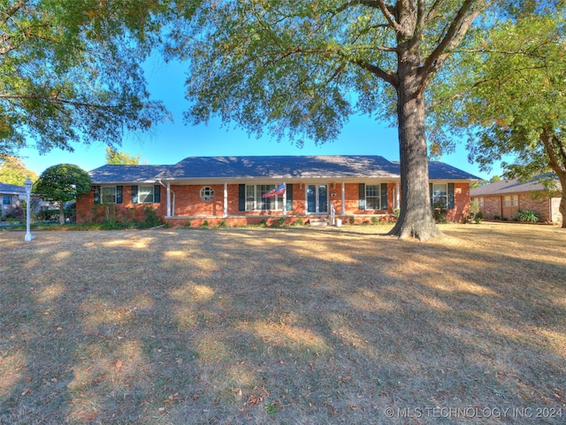 ranch-style home with covered porch