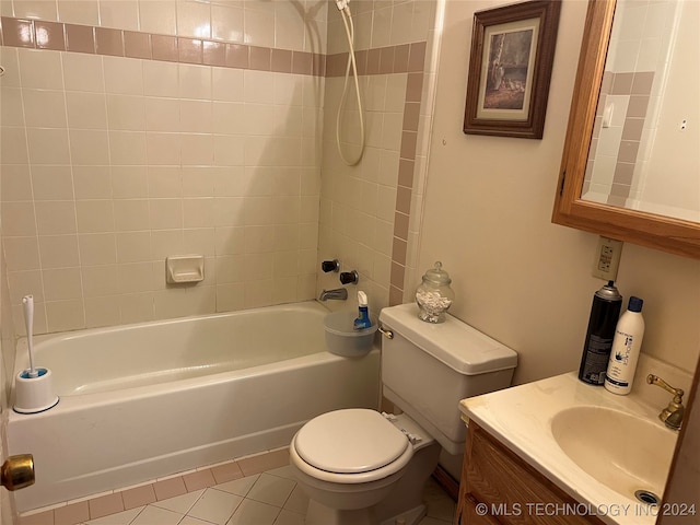 full bathroom featuring vanity, toilet, tile patterned floors, and tiled shower / bath