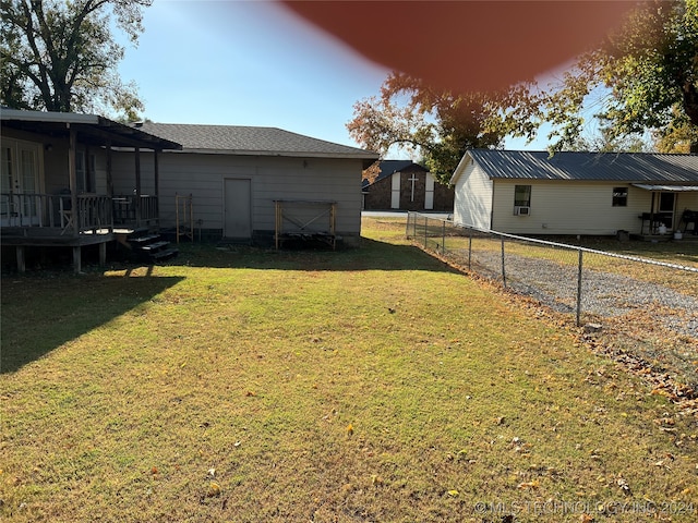 view of yard featuring a wooden deck