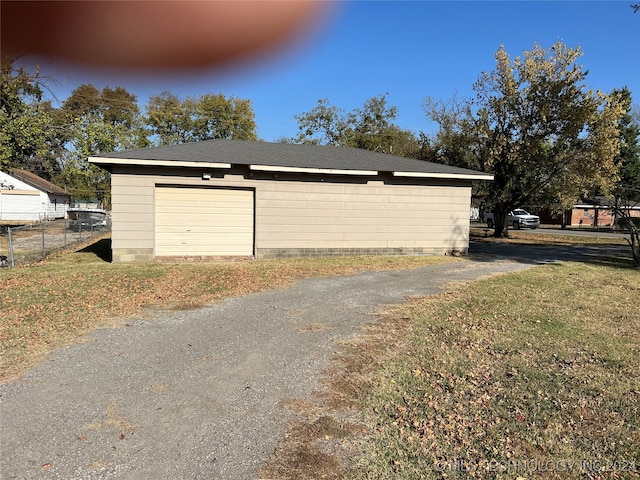 garage with a yard