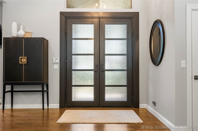 foyer with french doors and wood-type flooring