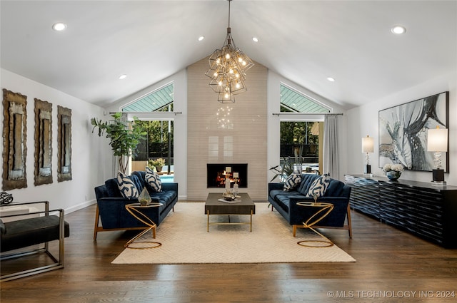 living room with a fireplace, vaulted ceiling, and dark hardwood / wood-style floors