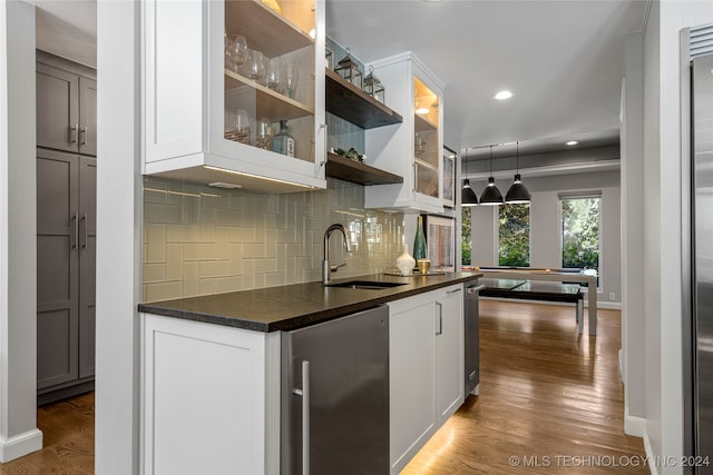 kitchen featuring white cabinetry, sink, and dark wood-type flooring