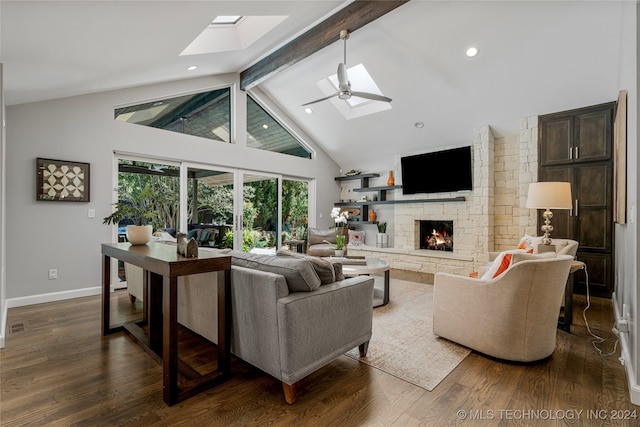 living room with beam ceiling, dark hardwood / wood-style flooring, a fireplace, high vaulted ceiling, and ceiling fan