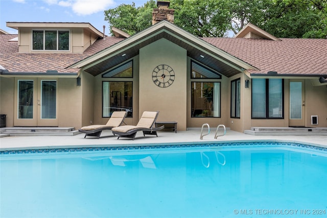 rear view of property featuring a patio area