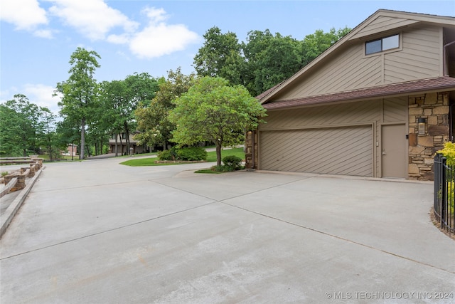 view of property exterior featuring a garage